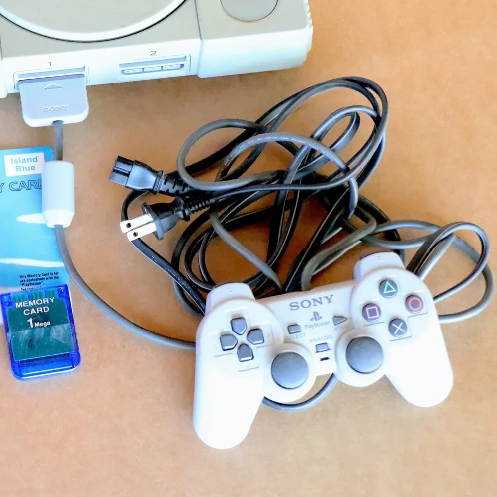 Original Sony Playstation PS1 console + Dual Shock controller + memory cards